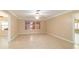 Bright living room with tile flooring and neutral color scheme at 997 Nash Loop, The Villages, FL 32162