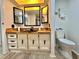 Bathroom featuring a toilet, wood countertop, black sink, storage and lighted ceiling at 105 Temple W Cv, Leesburg, FL 34748