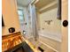 Bathroom featuring a shower, storage and wood countertop with a black sink at 105 Temple W Cv, Leesburg, FL 34748