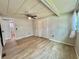 Spacious bedroom featuring new light wood flooring, closet and a ceiling fan at 105 Temple W Cv, Leesburg, FL 34748