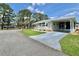 Charming single-story home with a well-manicured lawn and covered parking at 105 Temple W Cv, Leesburg, FL 34748