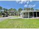 Exterior view with well-maintained lawn and convenient golf cart parking at 105 Temple W Cv, Leesburg, FL 34748