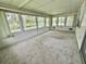 Light-filled Florida room with views of the peaceful lakeside at 105 Temple W Cv, Leesburg, FL 34748