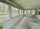 Bright Florida room with tranquil lake views at 105 Temple W Cv, Leesburg, FL 34748