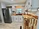 Bright kitchen showcases wood countertops, stainless steel refrigerator, and black sink at 105 Temple W Cv, Leesburg, FL 34748