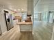 Open kitchen design with stainless steel appliances and butcher block countertops at 105 Temple W Cv, Leesburg, FL 34748