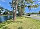 Scenic view of community lake with trees at 105 Temple W Cv, Leesburg, FL 34748