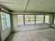 Enclosed porch overlooking the community lake at 105 Temple W Cv, Leesburg, FL 34748