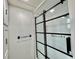Bathroom with a modern glass and black framed shower at 105 Temple W Cv, Leesburg, FL 34748