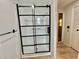 Bathroom with a modern glass shower and black trim at 105 Temple W Cv, Leesburg, FL 34748
