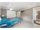 Comfortable bedroom with tiled flooring, ceiling fan and a closet for extra storage at 1113 Elkhart Cir, Tavares, FL 32778