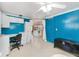Blue bedroom offers built-in cabinets, desk and storage space plus a chest at 1113 Elkhart Cir, Tavares, FL 32778