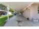 Covered carport area featuring a painted concrete floor at 1113 Elkhart Cir, Tavares, FL 32778