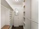 Spacious walk-in closet with ample storage and shelving units for shoes and hanging clothes at 1113 Elkhart Cir, Tavares, FL 32778