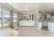 Inviting dining area featuring tiled floors, built-in cabinets, and large windows for ample natural light at 1113 Elkhart Cir, Tavares, FL 32778