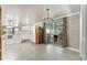Open concept kitchen features white appliances and cabinetry, and a view to the outside at 1113 Elkhart Cir, Tavares, FL 32778