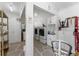 Laundry room with dual washers and dryers, built-in cabinets, and overhead lighting at 1113 Elkhart Cir, Tavares, FL 32778