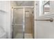Tiled shower with sliding glass doors, perfect for a refreshing cleanse and daily routines at 1113 Elkhart Cir, Tavares, FL 32778