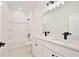 Bright bathroom featuring a double vanity with white countertop and tub with shower combo at 1191 Stratton Ave, Groveland, FL 34736