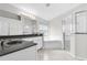 Modern bathroom with double sinks, a soaking tub, and a glass-enclosed shower, providing a spa-like experience at 12838 Owasso Ln, Clermont, FL 34711