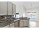Functional kitchen with granite countertops, stainless steel appliances, and stylish backsplash at 12838 Owasso Ln, Clermont, FL 34711