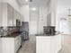 Well-equipped kitchen featuring stainless steel appliances, granite countertops, and tiled flooring at 12838 Owasso Ln, Clermont, FL 34711