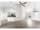 Inviting living area featuring views of the kitchen, sleek flooring, and a welcoming atmosphere at 12838 Owasso Ln, Clermont, FL 34711