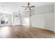Open-concept living room filled with natural light, showcasing a modern design and beautiful flooring at 12838 Owasso Ln, Clermont, FL 34711