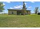 The home features a well-maintained backyard with space for outdoor living and entertainment at 12952 Del Lago Dr, Astatula, FL 34705