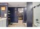 Bathroom features vanity, walk-in closet, and shower with glass door at 12952 Del Lago Dr, Astatula, FL 34705