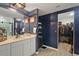 Bathroom view showcasing a vanity, closet, and updated fixtures at 12952 Del Lago Dr, Astatula, FL 34705