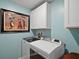 Bright laundry room with washer, dryer, and cabinets at 12952 Del Lago Dr, Astatula, FL 34705