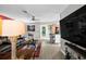 Bright living room with a sleek ceiling fan, hardwood floors, and an open layout at 12952 Del Lago Dr, Astatula, FL 34705