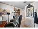 Office area featuring desk space, shelving, and decorative wall art at 12952 Del Lago Dr, Astatula, FL 34705