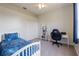 This bedroom features a ceiling fan, closet, bookshelf, study desk and chair at 13100 Lakewind Dr, Clermont, FL 34711