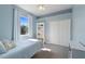 Bedroom featuring a twin bed, closet, dresser, and a window for natural light at 13100 Lakewind Dr, Clermont, FL 34711