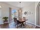 Comfortable dining area with wood floors, natural lighting, and simple, attractive decor at 13100 Lakewind Dr, Clermont, FL 34711