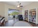 Cozy living room with access to a screened lanai and pool, filled with natural light at 13100 Lakewind Dr, Clermont, FL 34711