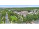 Aerial view shows townhomes with green spaces, mature trees, and access to well-maintained community areas at 14421 Vashons Way, Winter Garden, FL 34787