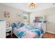 Bedroom featuring ceiling fan, dresser and natural light at 14421 Vashons Way, Winter Garden, FL 34787