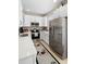 Modern kitchen with stainless steel appliances and white countertops at 14421 Vashons Way, Winter Garden, FL 34787