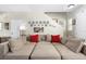Spacious living room showcasing a large sectional sofa, hardwood floors, and staircase access at 14421 Vashons Way, Winter Garden, FL 34787