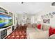 Cozy living room with hardwood floors, a comfortable sectional sofa, and a large entertainment center at 14421 Vashons Way, Winter Garden, FL 34787