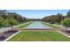 A central water feature and green space creates a serene, park-like atmosphere in the community at 14421 Vashons Way, Winter Garden, FL 34787