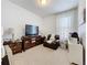 Bedroom with TV and comfortable chair at 1454 Westbury Dr, Clermont, FL 34711