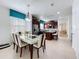 Dining room featuring a stylish dining table and chairs, connecting to the kitchen area at 1454 Westbury Dr, Clermont, FL 34711