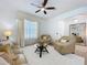 Inviting living space with plush seating, natural light, decorative pillows, and stylish decor at 1454 Westbury Dr, Clermont, FL 34711