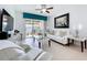 Bright living room with white furniture, tiled floors, and a view of the outdoor patio at 1454 Westbury Dr, Clermont, FL 34711