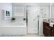 Bathroom featuring a soaking tub, separate shower with glass door, and vanity with sink at 1454 Westbury Dr, Clermont, FL 34711