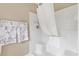 Bathroom shower with white tile, shower curtain, and towel rack at 1514 Vandam St, The Villages, FL 32162